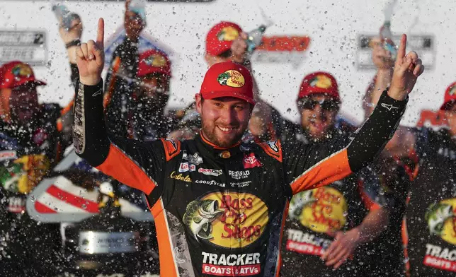 Chase Briscoe celebrates in Victory Lane after winning a NASCAR Cup Series auto race at Pocono Raceway, Sunday, June 22, 2025, in Long Pond, Pa. (AP Photo/Derik Hamilton)