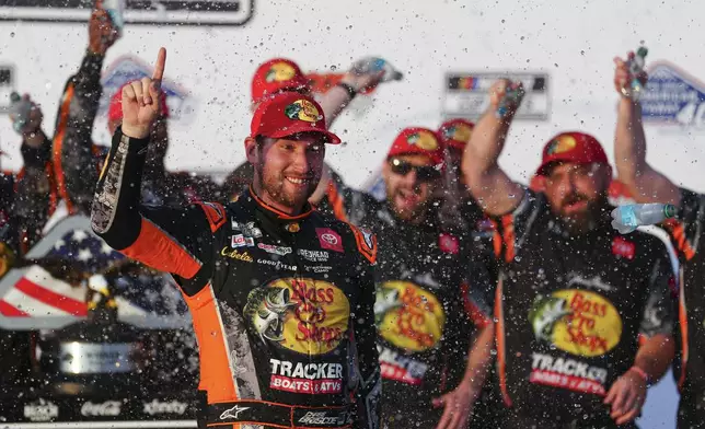 Chase Briscoe celebrates in Victory Lane after winning a NASCAR Cup Series auto race at Pocono Raceway, Sunday, June 22, 2025, in Long Pond, Pa. (AP Photo/Derik Hamilton)