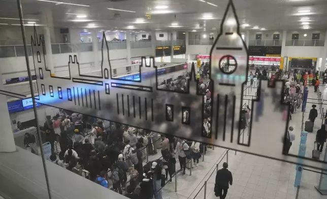 A general view of part of the departure hall that is used by Air India at Gatwick Airport near London, Thursday, June 12, 2025, after an Air India jet bound for London crashed in Ahmedabad, India with more than 240 people on board. (AP Photo/Kin Cheung)