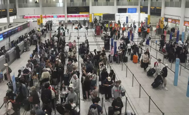 A general view of part of the departure hall that is used by Air India at Gatwick Airport near London, Thursday, June 12, 2025, after an Air India jet bound for London crashed in Ahmedabad, India with more than 240 people on board. (AP Photo/Kin Cheung)