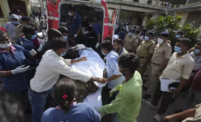 Remains of victims are brought to Civil Hospital after an airplane crashed in India's northwestern city of Ahmedabad in Gujarat state, Thursday, June 12, 2025. (AP Photo/Ajit Solanki)