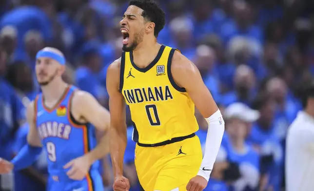Indiana Pacers guard Tyrese Haliburton reacts after scoring during the first half of Game 7 of the NBA Finals basketball series against the Oklahoma City Thunder Sunday, June 22, 2025, in Oklahoma City. (AP Photo/Julio Cortez)