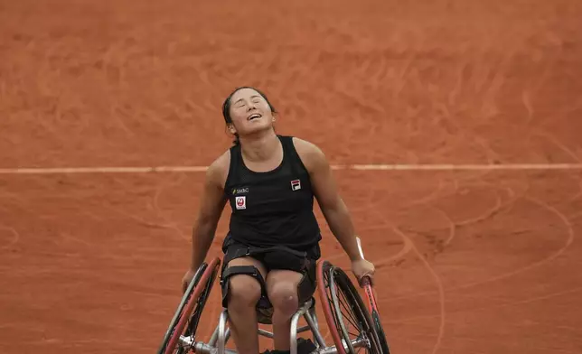 Japan's Yui Kamiji celebrates as she won the women's wheelchair singles final match of the French Tennis Open against Netherlands' Aniek Van Koot at the Roland-Garros stadium in Paris, Saturday, June 7, 2025. (AP Photo/Christophe Ena)