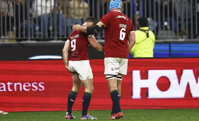 Tadhg Beirne of the British &amp; Irish Lions gestures to teammate Tomos Williams, left, after he's scored a try during their rugby match against the Western Force in Perth, Australia, Saturday, June 28, 2025. (AP Photo/Trevor Collens)