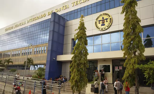 Relatives of Alejandro Henriquez and Jose Angel Perez wait outside the courts during their hearing in Santa Tecla, El Salvador, Friday, May 30, 2025. The National Civil Police arrested them for protesting near the presidnetial residence. (AP Photo/Salvador Melendez)