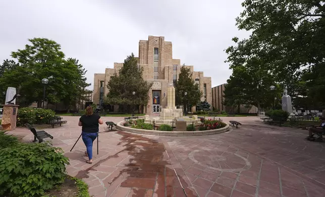 A person walks in front of the Boulder County, Colo., courthouse after an attack on the Pearl Street Mall Monday, June 2, 2025, in Boulder, Colo. (AP Photo/David Zalubowski)