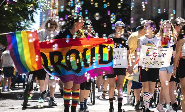 FILE - People walk in the Pittsburgh Pride Revolution March to celebrate Pride Month, June 4, 2022, in downtown Pittsburgh. (Alexandra Wimley/Pittsburgh Post-Gazette via AP, file)
