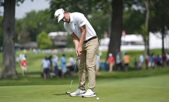 Andrew Putnam hits a birdie putt on the eighth hole during the first round of the Rocket Classic golf tournament at the Detroit Golf Club, Thursday, June 26, 2025, in Detroit. (AP Photo/Paul Sancya)