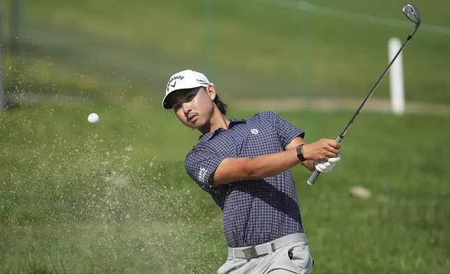Min Woo Lee, of Australia, hits a bunker shot on the second hole during the first round of the Rocket Classic golf tournament at the Detroit Golf Club, Thursday, June 26, 2025, in Detroit. (AP Photo/Paul Sancya)