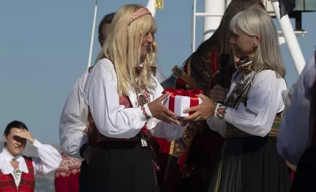 Pictured here, Karine Hagen, Viking Executive Vice President of Product, presented godmother of the Viking Vesta, Lene Tangevald-Jensen, with a gift during the naming ceremony. For more information, visit www.viking.com.