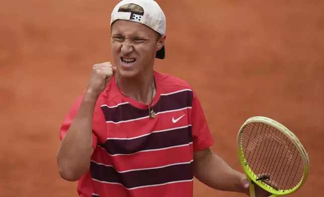 Germany's Max Schoenhaus reacts during boys' singles final match of the French Tennis Open at the Roland-Garros against Germany's Niels Mcdonald in Paris, Saturday, June 7, 2025. (AP Photo/Thibault Camus)