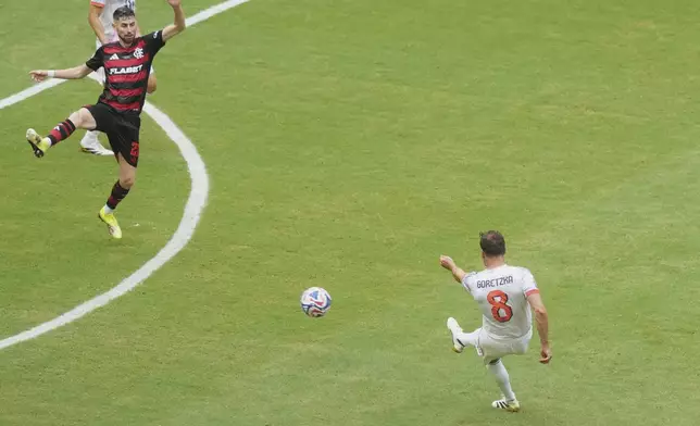 Bayern Munich's Leon Goretzka, right, scores his side's 3rd goal during the Club World Cup round of 16 soccer match between CR Flamengo and Bayern Munich in Miami Gardens, Fla., Sunday, June 29, 2025. (AP Photo/Marta Lavandier)