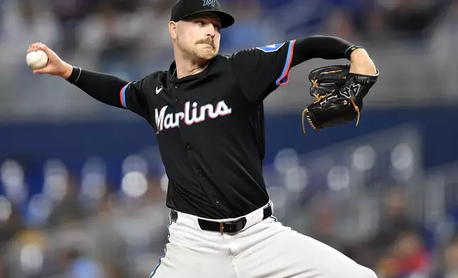 Miami Marlins pitcher Janson Junk throws to an Atlanta Braves hitter during the first inning of a baseball game, Friday, June 20, 2025, in Miami. (AP Photo/Michael Laughlin)