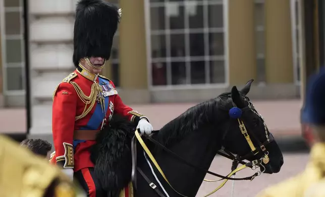 FILE - Britain's King Charles III attends the Trooping The Colour parade, in London, June 17, 2023. Trooping the Colour is the King's Birthday Parade and one of the nation's most impressive and iconic annual events attended by almost every member of the Royal Family.(AP Photo/Alastair Grant, File)