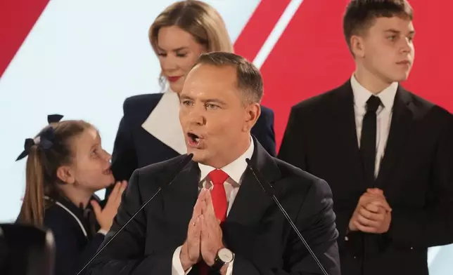 Presidential candidate Karol Nawrocki, a conservative historian backed by the right-wing Law and Justice party addresses supporters at his headquarters after the presidential election runoff in Warsaw, Poland, Sunday, June 1, 2025. (AP Photo/Czarek Sokolowski)