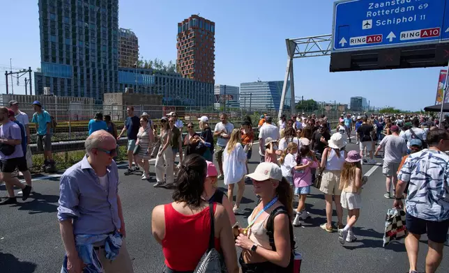 The Dutch capital celebrates its 750th anniversary with weddings, music and other events on the A10 motorway bypass in Amsterdam, Netherlands, Saturday, June 21, 2025. (AP Photo/Peter Dejong)
