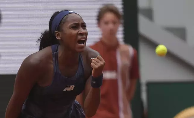 Coco Gauff of the U.S. celebrates as she won the fourth round match of the French Tennis Open against Russia's Ekaterina Alexandrova at the Roland-Garros stadium in Paris, Monday, June 2, 2025. (AP Photo/Thibault Camus)