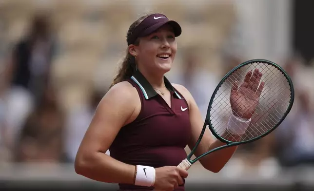 Russia's Mirra Andreeva celebrates as she won the fourth round match of the French Tennis Open against Australia's Daria Kasatkina at the Roland-Garros stadium in Paris, Monday, June 2, 2025. (AP Photo/Christophe Ena)