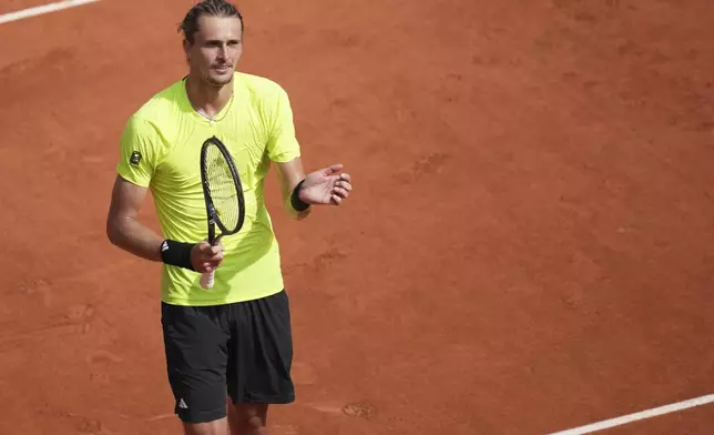 Germany's Alexander Zverev celebrates after beating Italy's Flavio Cobolli during their third round match of the French Tennis Open, at the Roland-Garros stadium, in Paris, Saturday, May 31, 2025. (AP Photo/Christophe Ena)