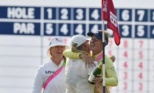 Maja Stark, of Sweden, celebrates with Linn Grant, of Sweden, after winning the U.S. Women's Open golf tournament at Erin Hills Sunday, June 1, 2025, in Erin, Wis. (AP Photo/Matt York)