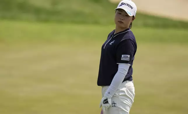 Rio Takeda, of Japan, putts on the fifth hole during the fourth round of the U.S. Women's Open golf tournament at Erin Hills Sunday, June 1, 2025, in Erin, Wis. (AP Photo/Jeff Roberson)