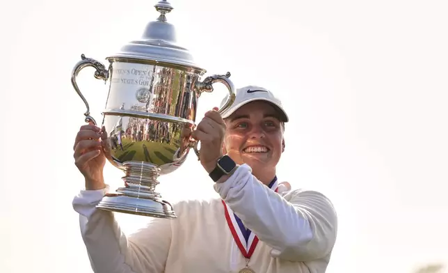 Maja Stark, of Sweden, holds her winning trophy after winning the U.S. Women's Open golf tournament at Erin Hills Sunday, June 1, 2025, in Erin, Wis. (AP Photo/Jeff Roberson)