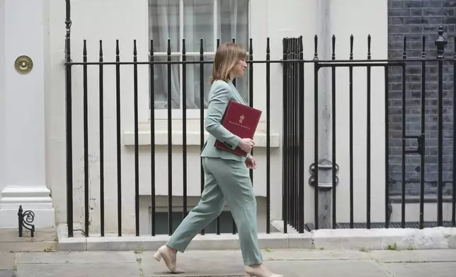 Britain's Chancellor of the Exchequer Rachel Reeves leaves 11 Downing Street to announce the government's Spending Review in Parliament, in London, Wednesday, June 11, 2025. (AP Photo/Kin Cheung)
