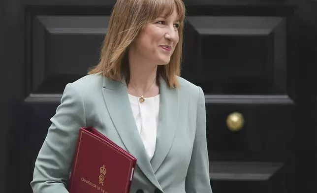 Britain's Chancellor of the Exchequer Rachel Reeves leaves 11 Downing Street to announce the government's Spending Review in Parliament, in London, Wednesday, June 11, 2025. (AP Photo/Kin Cheung)