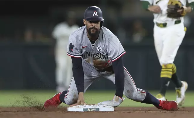 Minnesota Twins' Byron Buxton steals second base against the Athletics during the sixth inning of a baseball game Monday, June 2, 2025, in West Sacramento, Calif. (AP Photo/Scott Marshall)