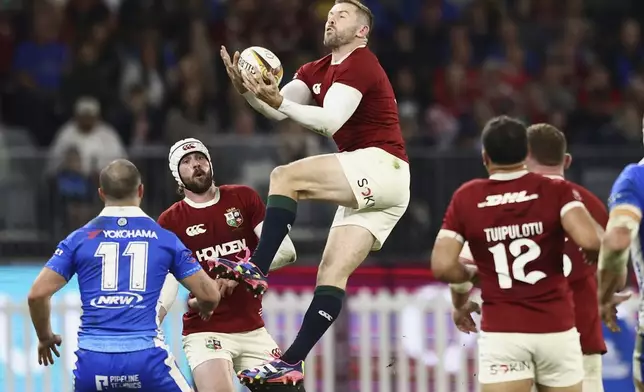 Elliot Daly of the British &amp; Irish Lions leaps in the air to catch the ball during their rugby match against the Western Force in Perth, Australia, Saturday, June 28, 2025. (AP Photo/Trevor Collens)