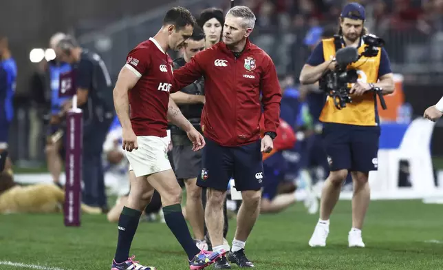 Tomos Williams of the British &amp; Irish Lions is assisted from the field during their rugby match against the Western Force in Perth, Australia, Saturday, June 28, 2025. (AP Photo/Trevor Collens)