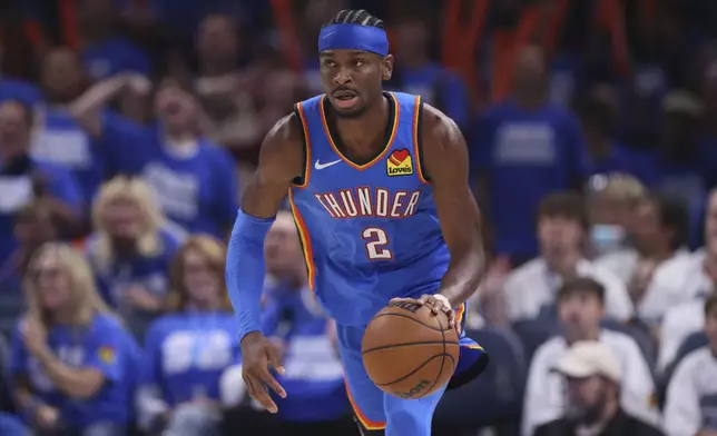 Oklahoma City Thunder guard Shai Gilgeous-Alexander (2) dribbles down the court during the second half of Game 5 of the Western Conference finals of the NBA basketball playoffs against the Minnesota Timberwolves, Wednesday, May 28, 2025, in Oklahoma City. (AP Photo/Nate Billings)