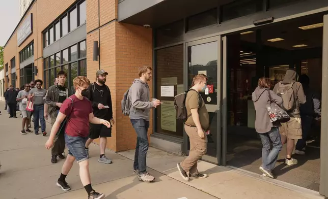 People line up outside a Target store for the new Nintendo Switch 2 video game consoles on Thursday, June 5, 2025 in Chicago. (AP Photo/Kiichiro Sato)