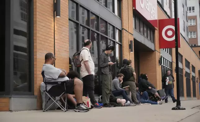 People line up outside a Target store for the new Nintendo Switch 2 video game consoles on Thursday, June 5, 2025 in Chicago. (AP Photo/Kiichiro Sato)