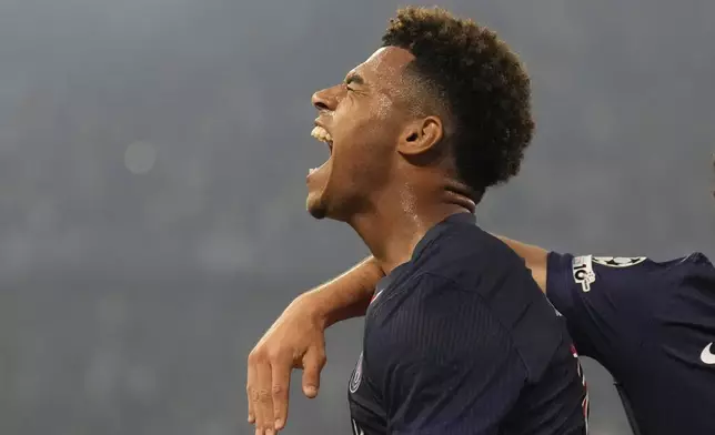 PSG's Desire Doue celebrates after scoring his side's second goal against Inter Milan during the Champions League final soccer match at the Allianz Arena in Munich, Germany, May 31, 2025. (AP Photo/Matthias Schrader)