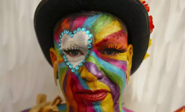 A drag queen known as Raul poses for a photo during the annual Gay Pride parade marking LGBTQ+ Pride Month, in Santiago, Chile, Saturday, June 21, 2025. (AP Photo/Esteban Felix)