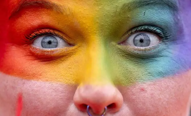 People take part in the Pride Edinburgh 2025 parade through Edinburgh city center, Scotland, Saturday June 21, 2025. (Jane Barlow/PA via AP)