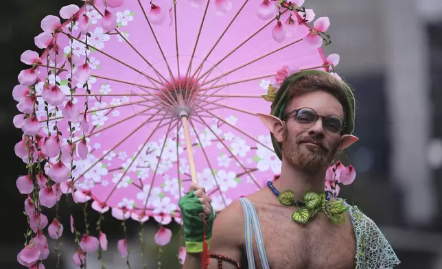 A reveler takes part in the annual Pride parade marking LGBTQ+ Pride Month, in Sao Paulo, Sunday, June 22, 2025. (AP Photo/Ettore Chiereguini)