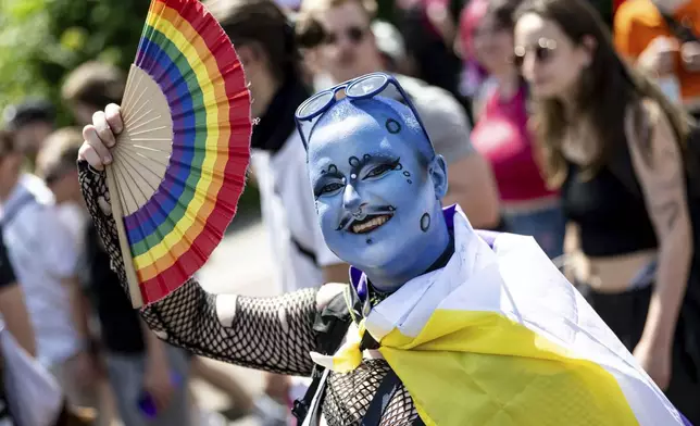 People take part in a Pride parade in Berlin, Saturday, June 21, 2025. (Fabian Sommer/dpa via AP)