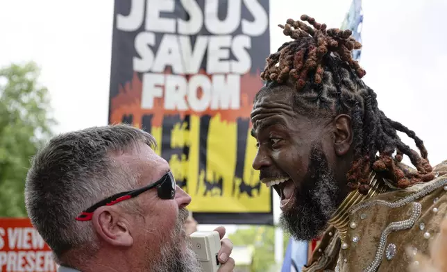 A parade attendee shouts at a Christian protester during the Kentuckiana Pride Parade on Saturday, June 21, 2025, in Louisville, Ky. (AP Photo/Jon Cherry)