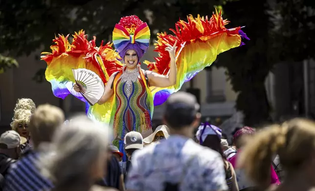 People take part in the Zurich Pride parade in Zurich, Switzerland, on Saturday, June 21, 2025. (Michael Buholzer/Keystone via AP)