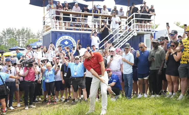 Rory McIlroy hits a chip shot from the rough on the fifth hole during the second round of the Canadian Open golf tournament in Caledon, Ontario, Friday, June 6, 2025. (Nathan Denette/The Canadian Press via AP)