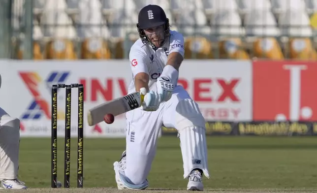 FILE - England's Joe Root plays a shot during the second day of the second test cricket match between Pakistan and England, in Multan, Pakistan, Wednesday, Oct. 16, 2024. (AP Photo/K.M. Chaudary, File)
