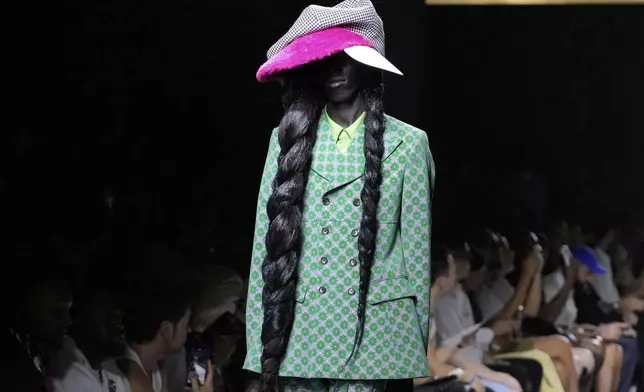 A model wears a creation part of the men's Comme des Garcons Homme Plus Spring-Summer 2026 collection, that was presented in Paris Friday, June 27, 2025. (AP Photo/Michel Euler)