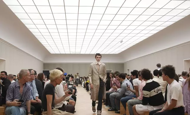 A model wears a creation for Dior Homme Spring-Summer 2026 collection, that was presented in Paris Friday, June 27, 2025. (AP Photo/Christophe Ena)