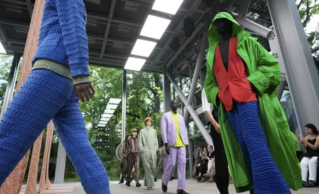 Models wear creations part of the Issey Miyake men's Spring-Summer 2026 collection, that was presented in Paris Thursday, June 26, 2025. (AP Photo/Michel Euler)