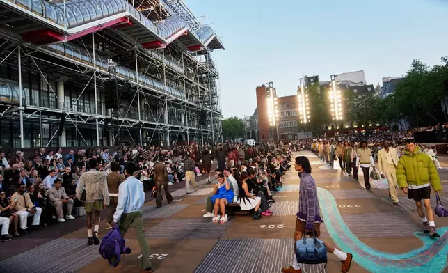 Models wear creations as part of the men's Louis Vuitton Spring-Summer 2026 collection, that was presented in Paris, Tuesday, June 24, 2025. (AP Photo/Michel Euler)