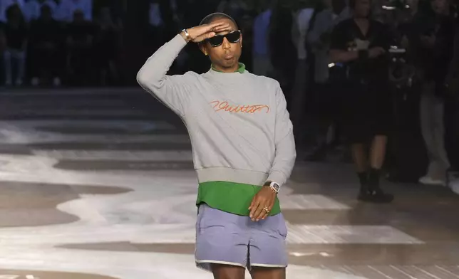 Designer Pharrell Williams takes the stage after the men's Louis Vuitton Spring-Summer 2026 collection, that was presented in Paris, Tuesday, June 24, 2025. (AP Photo/Michel Euler)