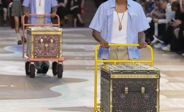 A model wears a creation as part of the men's Louis Vuitton Spring-Summer 2026 collection, that was presented in Paris, Tuesday, June 24, 2025. (AP Photo/Michel Euler)