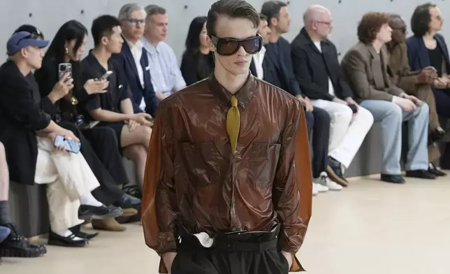 A model wears a creation as part of the men's Saint Laurent Spring-Summer 2026 collection, that was presented in Paris, Tuesday, June 24, 2025. (AP Photo/Michel Euler)